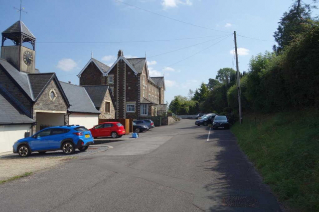 The station approach road and the former Carnarvon Arms Hotel. To the left of the camera was the Brushford Cattle Market. The old hotel is now apartments but still carries its name above a first floor window. Devon & Somerset Railway