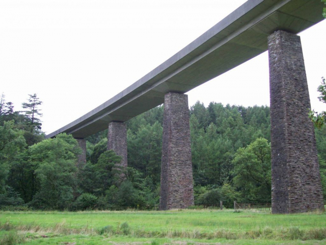 From the valley floor, four of the five original piers are seen; the fifth is at right. Devon & Somerset Railway