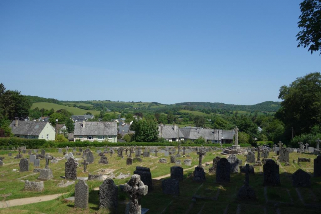 Former council housing lies before Bellacouch Meadow. The war memorial bears no names. Chagford