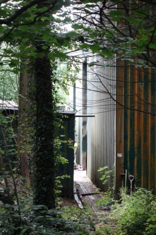 This hangar, with tracks for the massive doors, can be seen from the turnpike. The scout saw the inside when bus rallies were held here. Eggesford to Okehampton