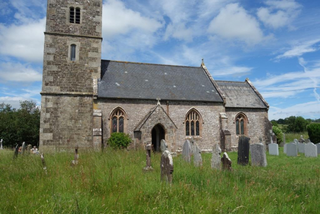 Some helpers were picnicking beside the tower of All Saints'. Eggesford to Okehampton