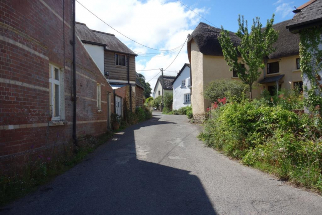 A lady stopped on Fore Street to tell the scout where the Post Office and bakery had been on Fore Street. She pointed him towards the community shop. Eggesford to Okehampton